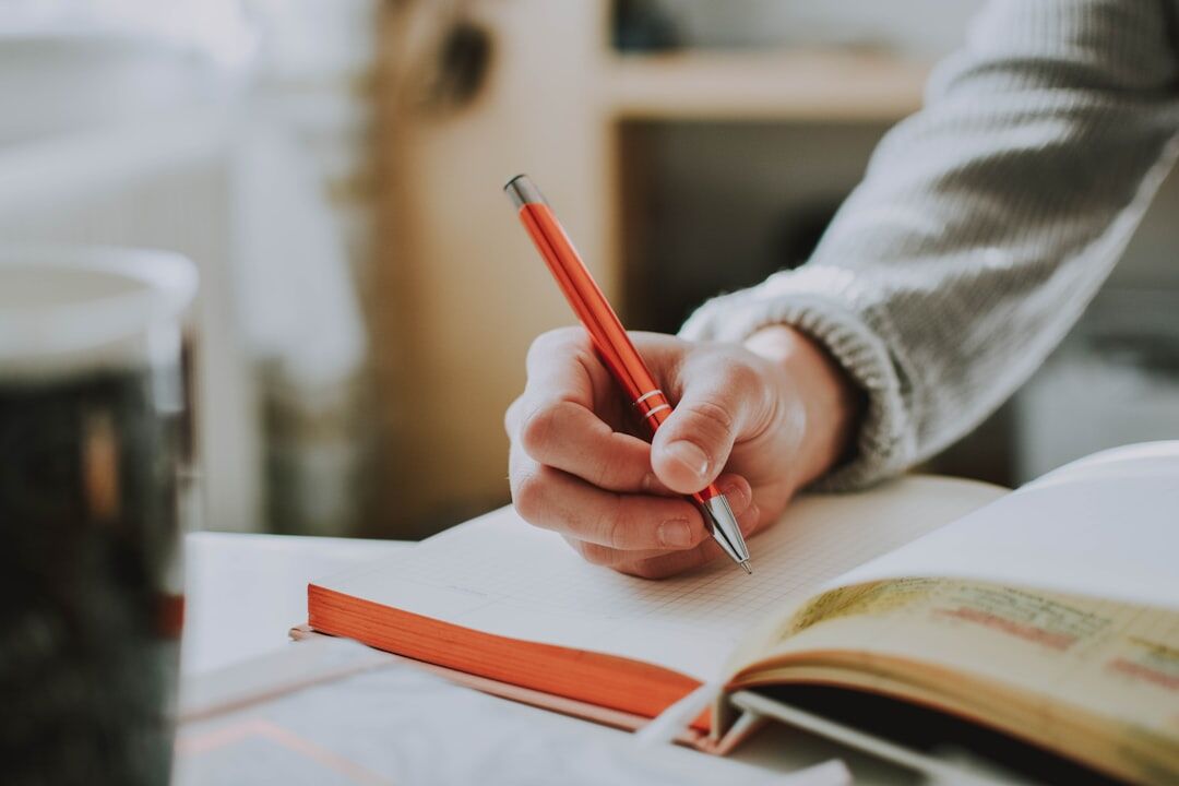 person writing book review